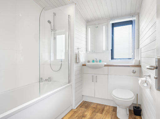 Family bathroom with shower over bath