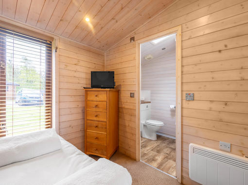 Family bathroom with shower over bath