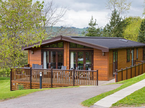 Lodge with path leading to decking area